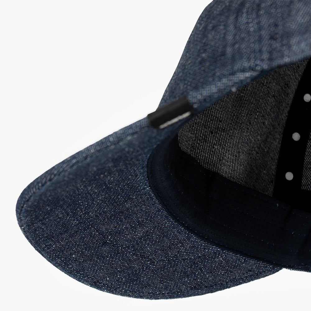 detail underbrim view of ciele athletics CRWCap short brim unisex running hat with shorter brim from the Lifestyle Edition collection, in denim indigo color