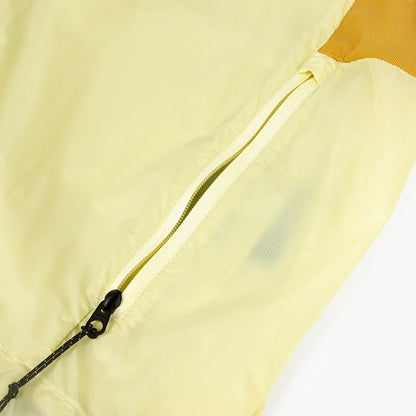 closeup view of the zippered side pocket of the ciele athletics VNTJacket lightweight running jacket for men in glade color