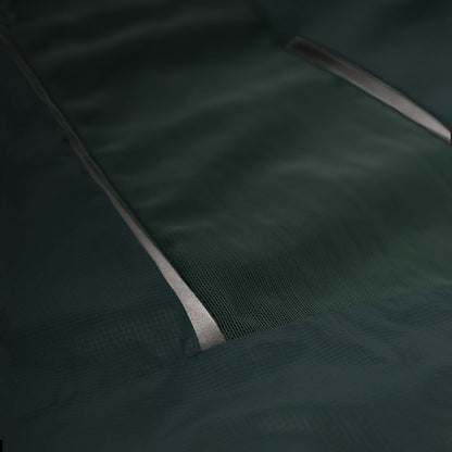 closeup view of the back airBEAM panel of the ciele athletics VNTJacket lightweight running jacket for men in silver pine color, when reflective