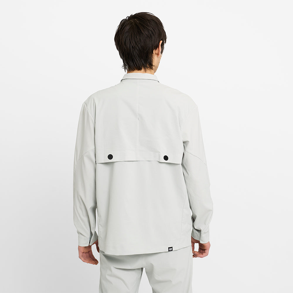 back view of ciele athletics CCJacket unisex running jacket from the Lifestyle Edition collection, in light grey color, on a model
