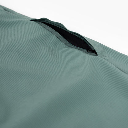 detail view of the zippered leg pocket of the ciele athletics CCPants unisex running pants from the Lifestyle Edition collection, in silver pine color