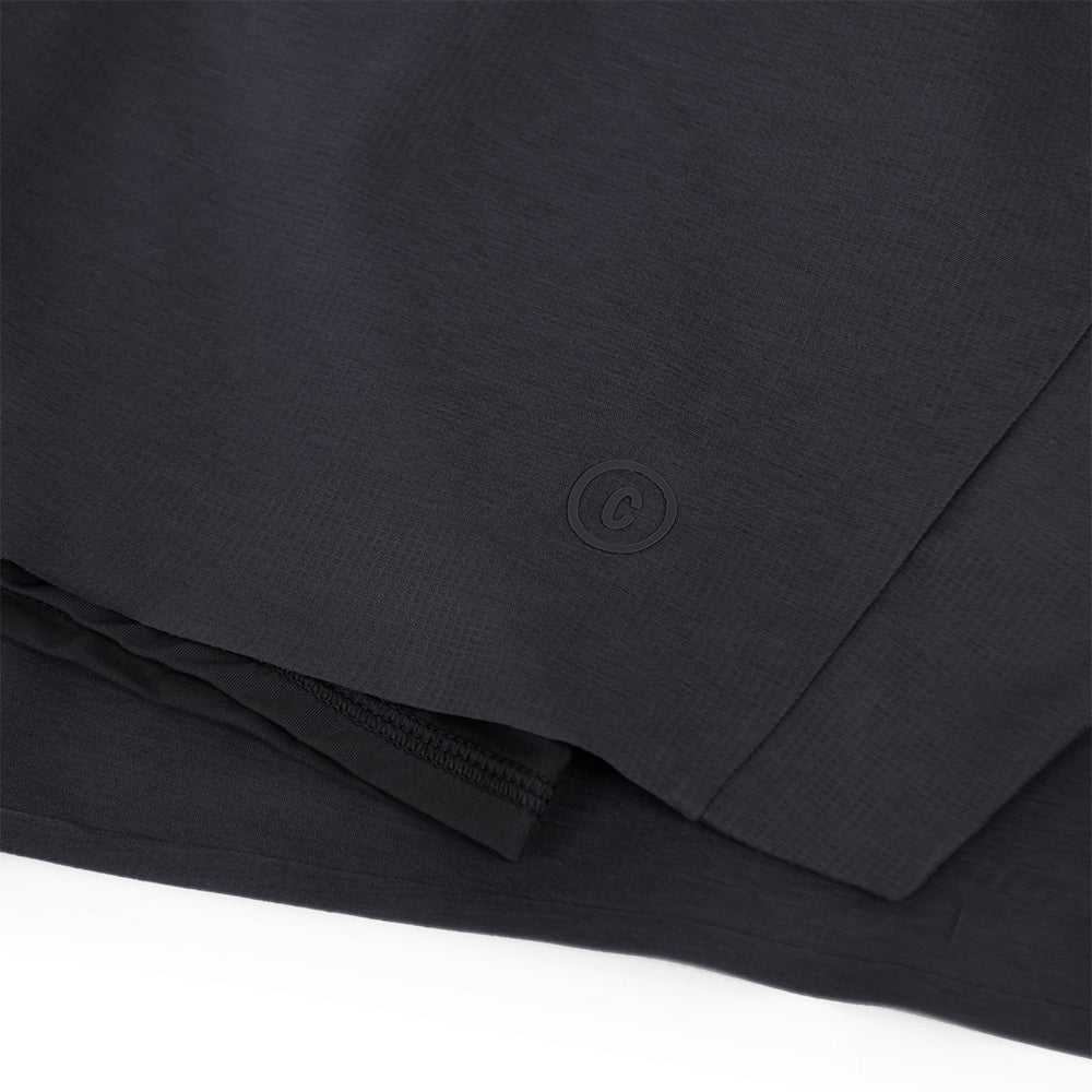 close view of the C logo and fabrics on the ciele athletics DLYShort 5 inch with a long brief in shadowcast color