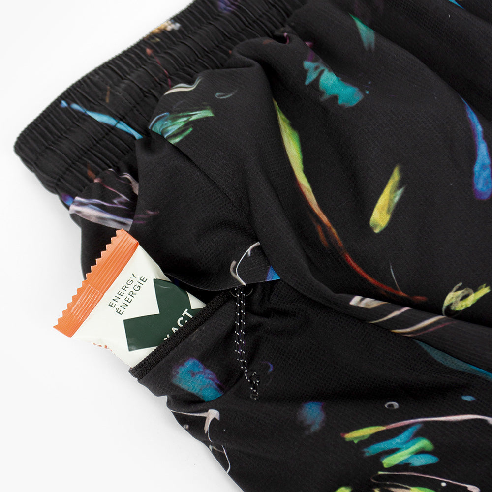 close view of the zippered side pocket of the ciele athletics ATShort 5 inch with liner short from the summer nights limited edition capsule, on a model