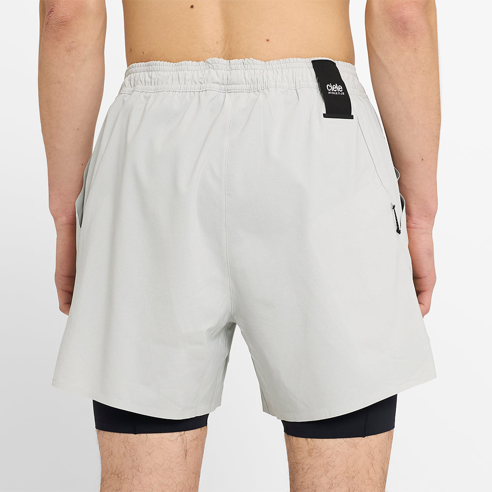 close back view of ciele athletics WRKShort unisex running and technical short from the Lifestyle Edition collection, in light grey color, on a model