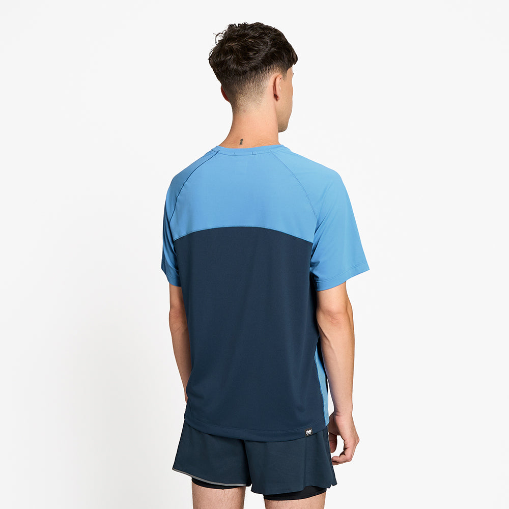 back view of ciele athletics DLYTShirt lightweight and performance driven T-Shirt in dusty blue on a model