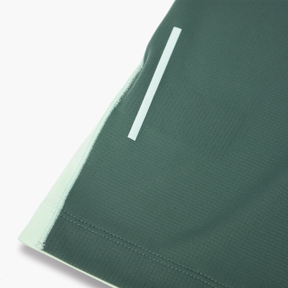 close view of the back reflective detail on the ciele athletics DLYTshirt lightweight and performance driven T-Shirt in dusty turquoise