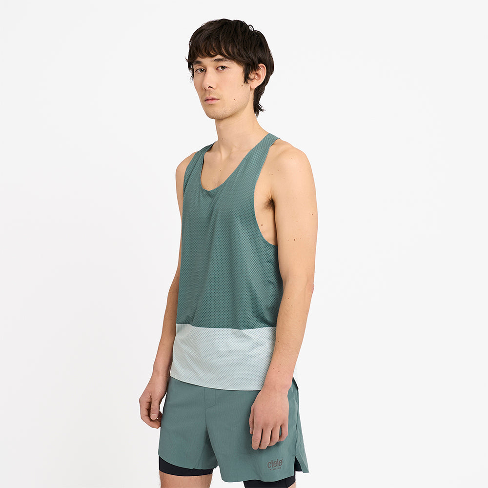 side view of the ciele athletics lightweight, race ready and performance driven singlet named RDSinglet in turquoise color from the lifetime edition, on a model