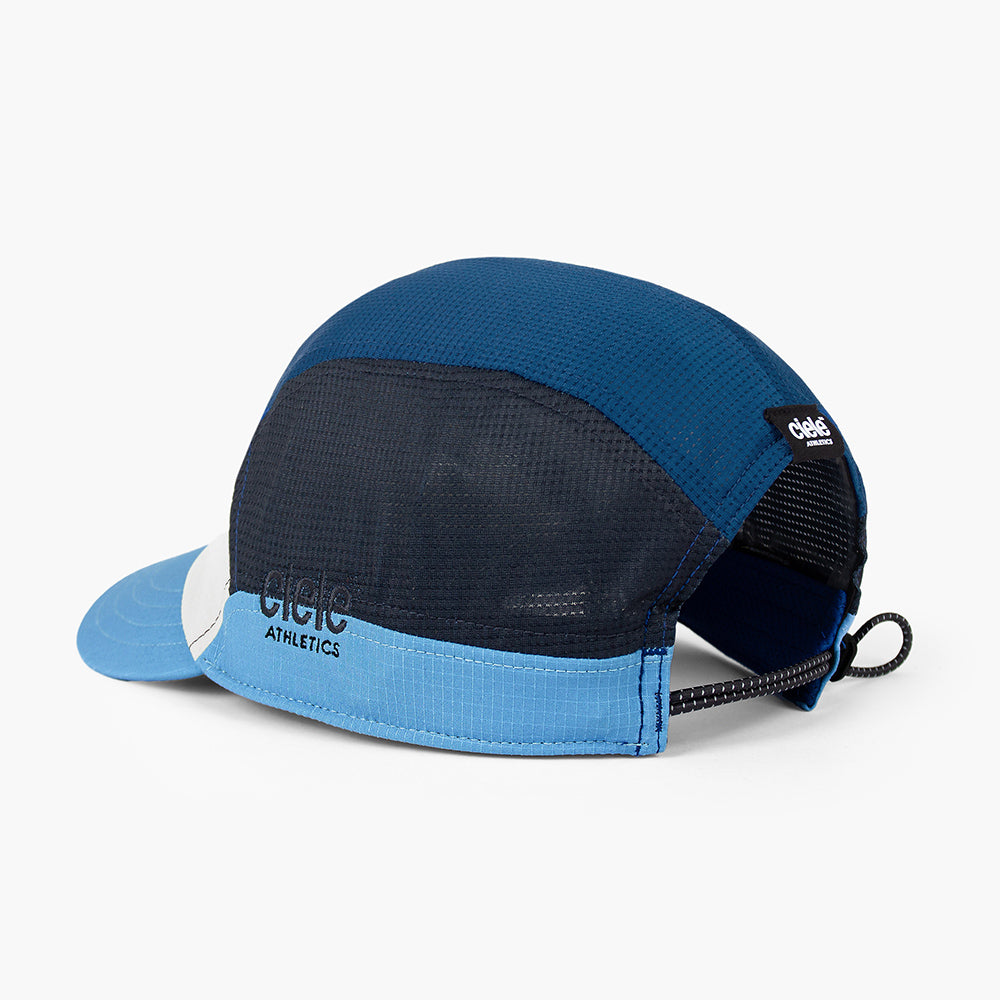 back view of the ciele athletics FTSCap unisex running hat in white cobalt color