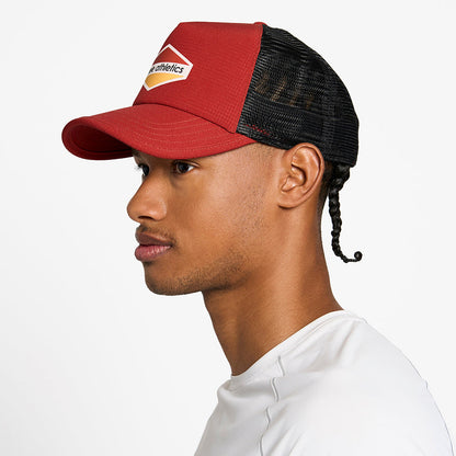 side view of the ciele athletics TRLCap unisex running hat with a curved brim in clay color, on a model