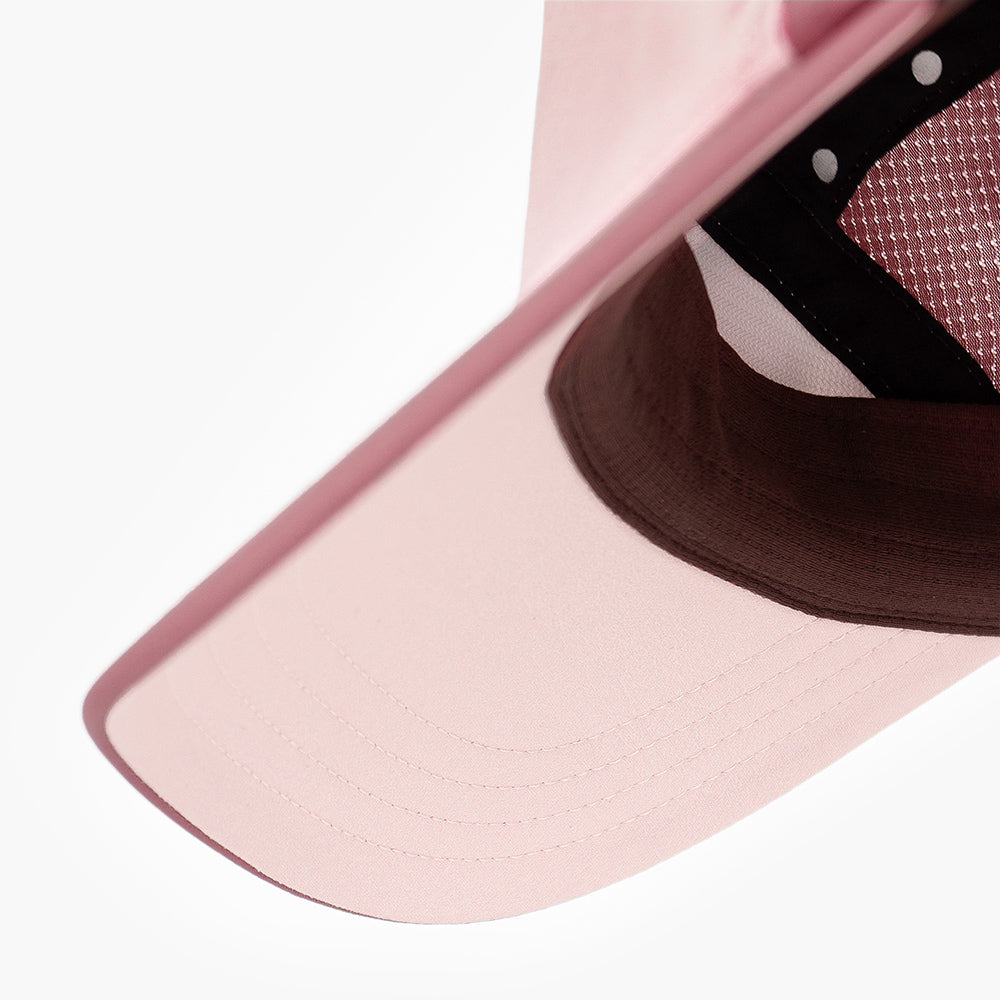 underbrim view of the ciele athletics FSTCap unisex running hat with a curved brim in peachskin color