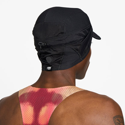 back view of ciele athletics GOCap solar unisex running hat from the Elite collection in shadowcast color, on a model with the side shield unfolded