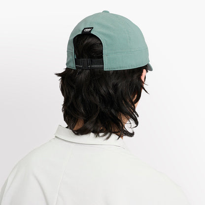 back view of ciele athletics CRWCap short brim unisex running hat with shorter brim from the Lifestyle Edition collection, in silver pine color, on a model