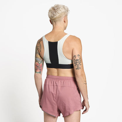 back view of ciele athletics QCKBra running bra in light grey on a model