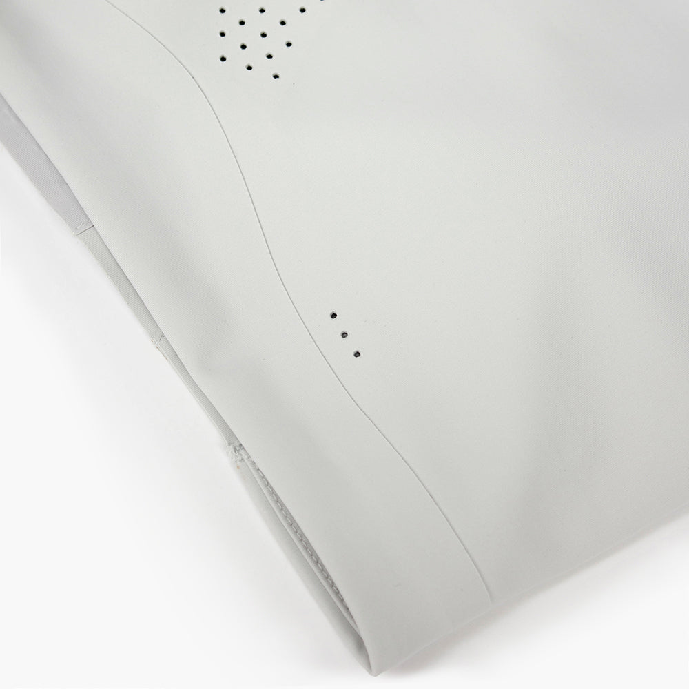 close view of the laser perforations on the ciele athletics SPDBra running bra in light grey