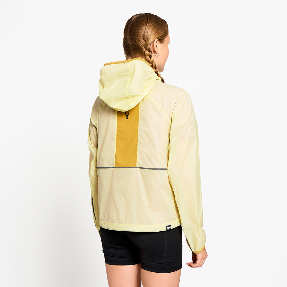 back view of ciele athletics VNTJacket lightweight running jacket for women in glade color on a model