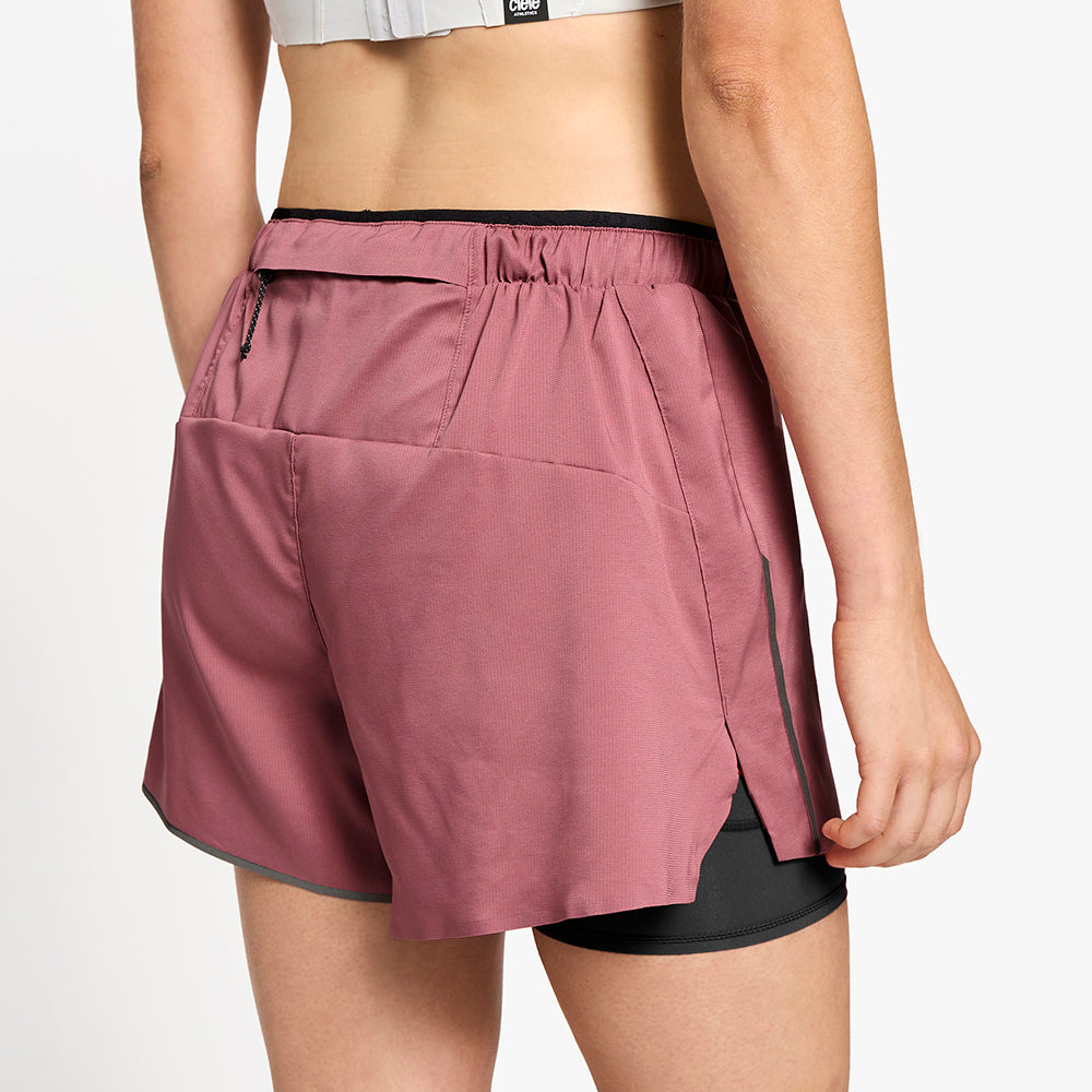 close back view of ciele athletics DLYShort 4 inch with a long brief in deco rose color on a model