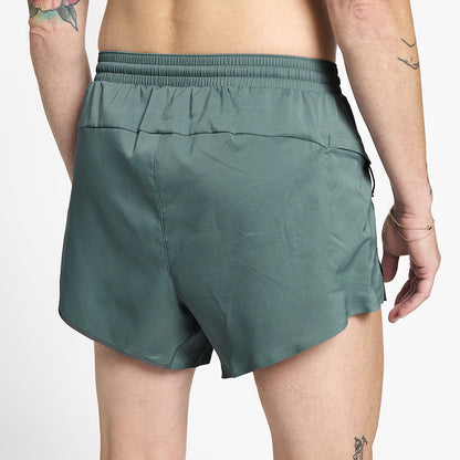close back view of ciele athletics ATShort 4 inch with liner short in silver pine color on a model