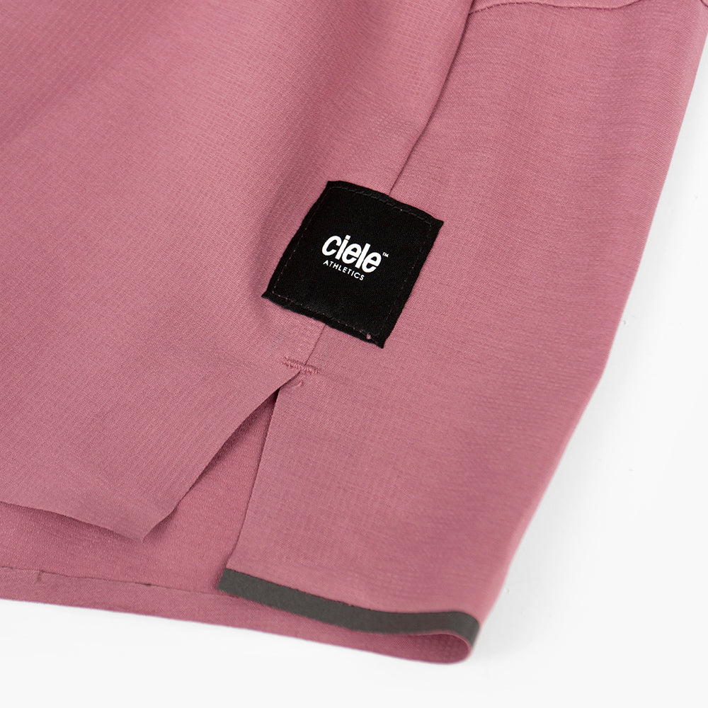 close view of the logo and fabric on the ciele athletics ATShort 4 inch with liner short in deco rose color