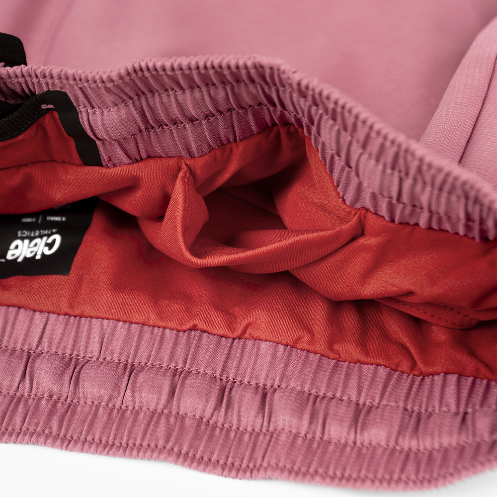 close view of the hidden front pocket of the ciele athletics ATShort 4 inch with liner short in deco rose color