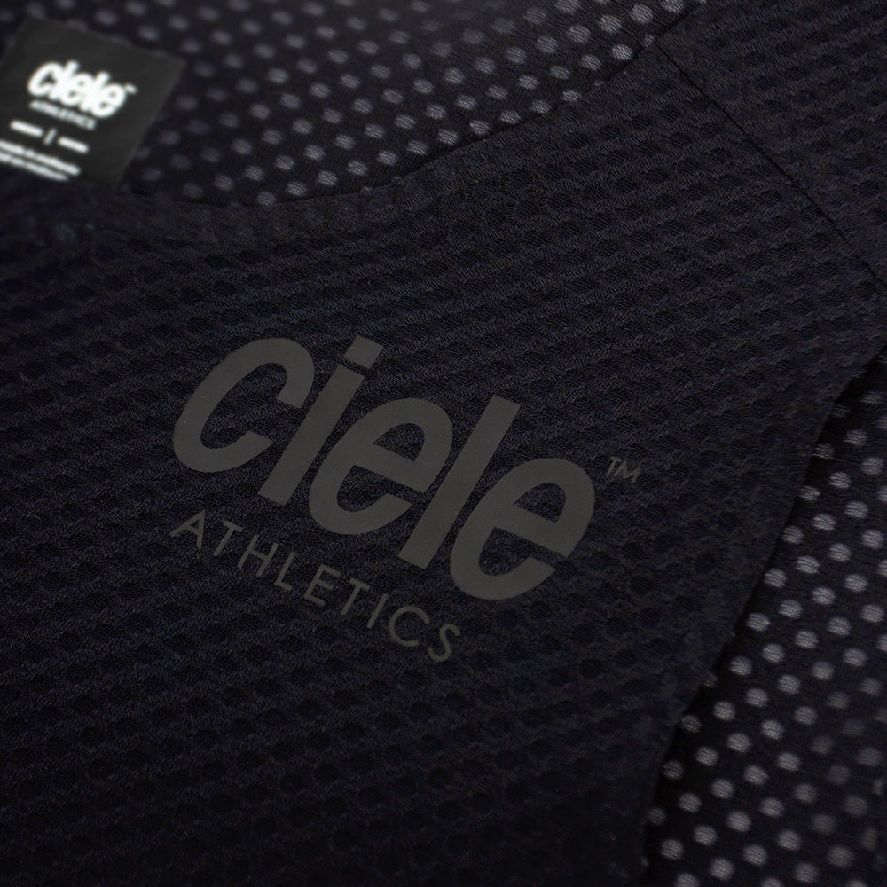 close up of the ciele logo of the ciele athletics lightweight, race ready and performance driven Singlet for womens named RDCRPSinglet in shadowsphinx color