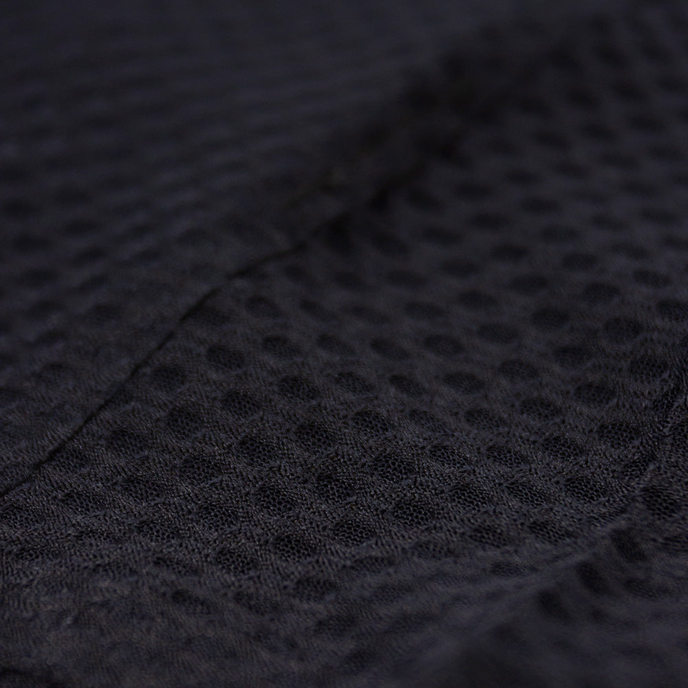 close up of the fabric of the ciele athletics lightweight, race ready and performance driven Singlet for womens named RDCRPSinglet in shadowsphinx color
