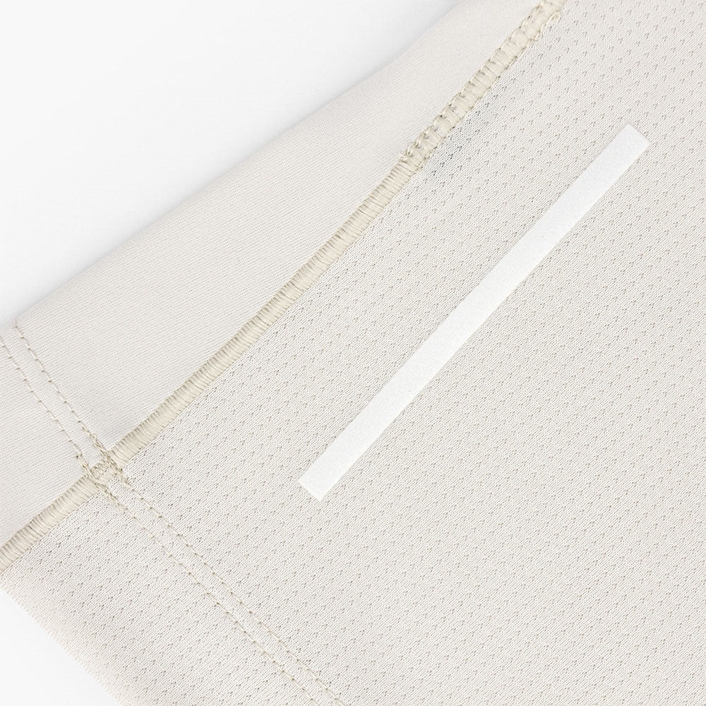 close view of the back reflective detail on the ciele athletics DLYTSinglet lightweight and performance driven singlet in rainy day